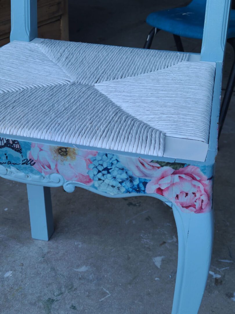 A chair with flowers painted on it