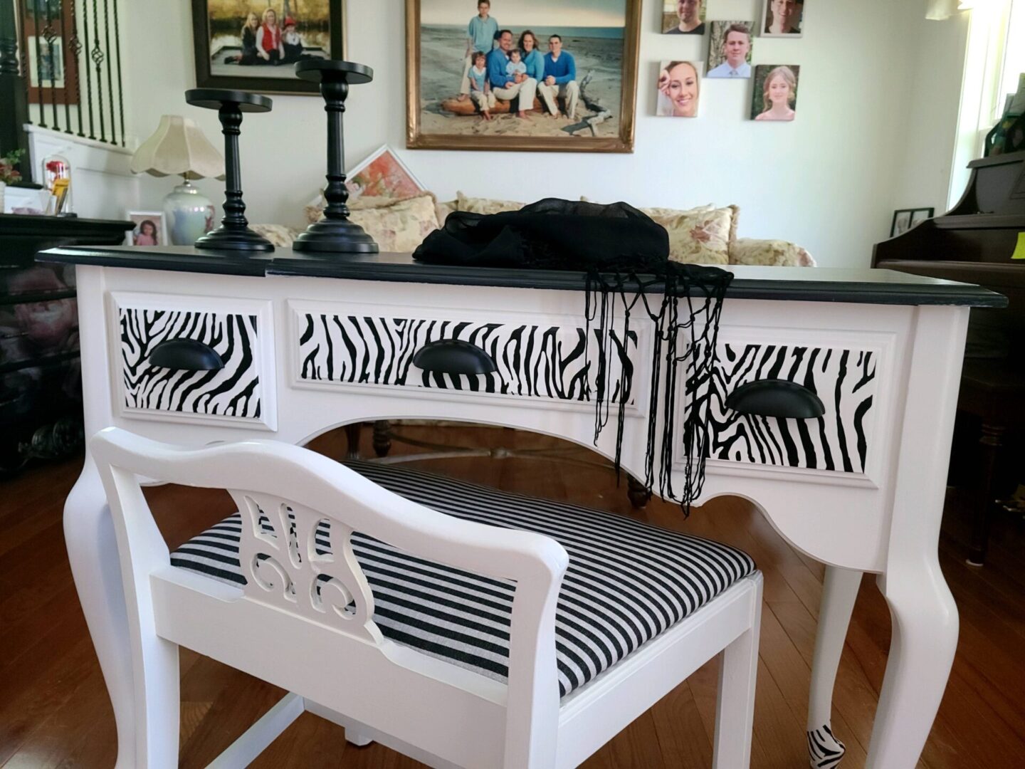 A desk with zebra print and black and white stripes.